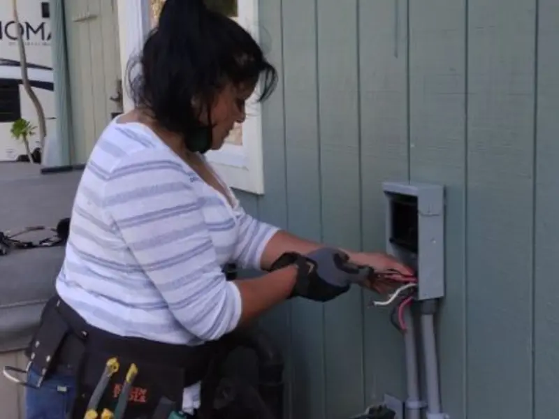 Licensed electrician wiring an exterior subpanel in Selah